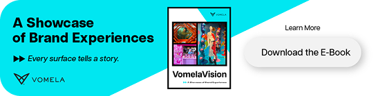 Advertisement for Vomela's 'A Showcase of Brand Experiences' e-book, with a 'Download the E-Book' button.